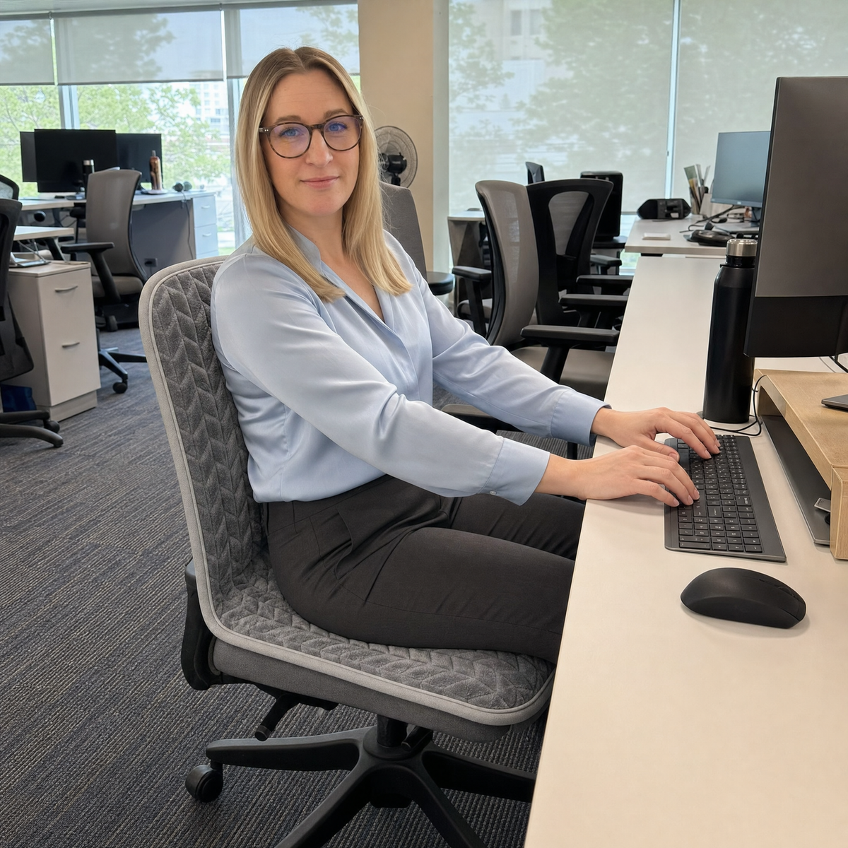 Woman working warm at her desk on Toastie Seat