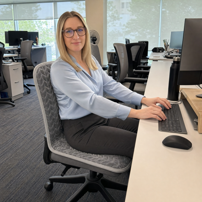 Woman working warm at her desk on Toastie Seat